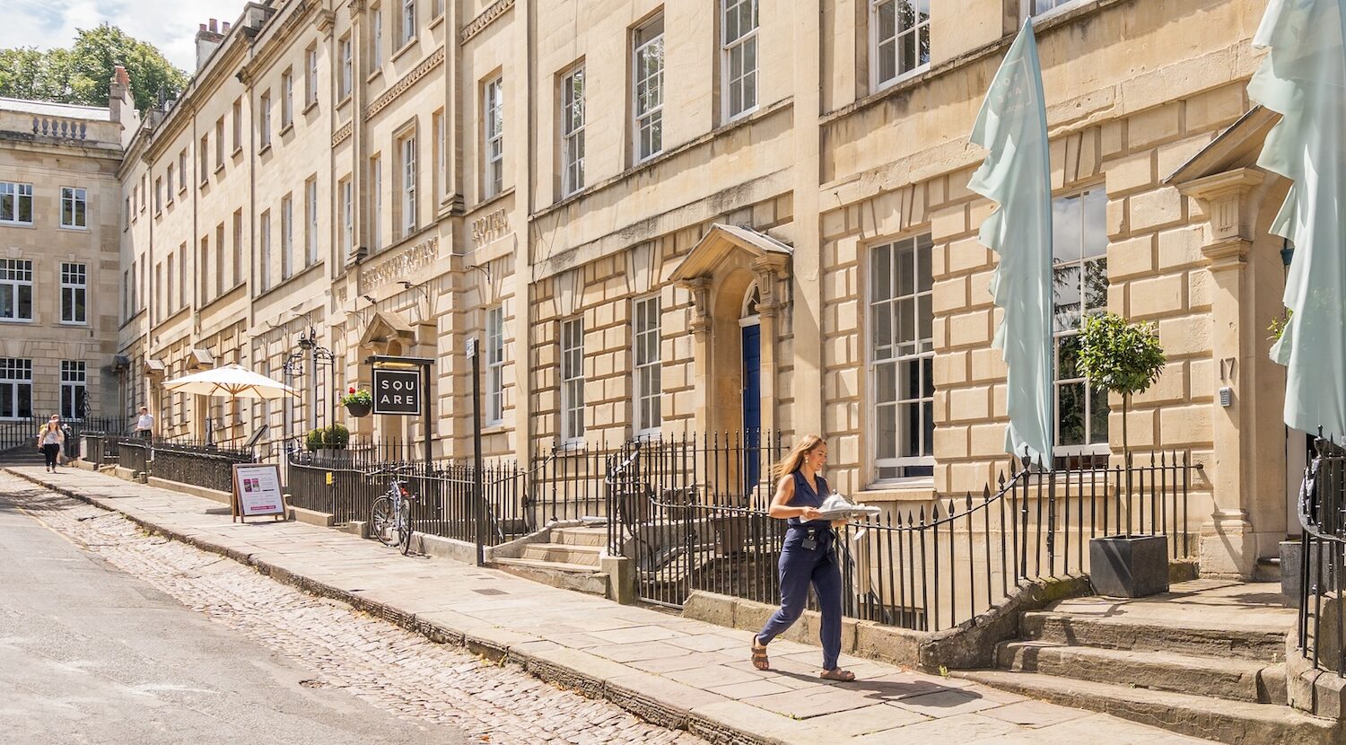 The elegant facade of The Square Club in Bristol, showcasing its historic architecture and entrance to the exclusive Square Works, offering premium office space in Bristol.